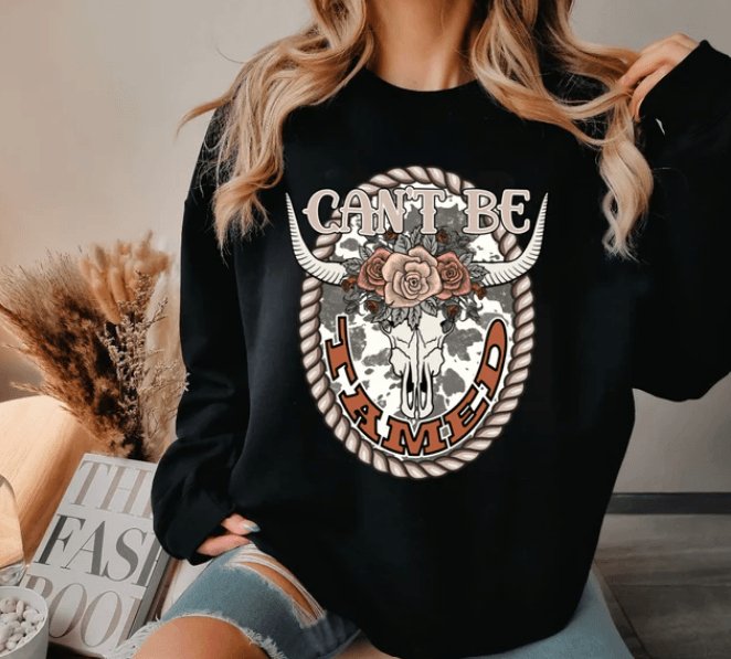 Can’t Be Tamed Graphic Sweater - Happily Ever Atchison Shop Co.